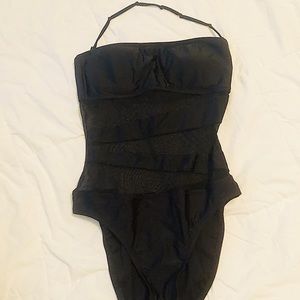 One piece black swim suit.